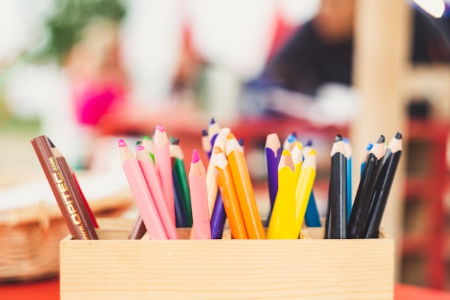 Colorful pencils ready for a play-based therapy session